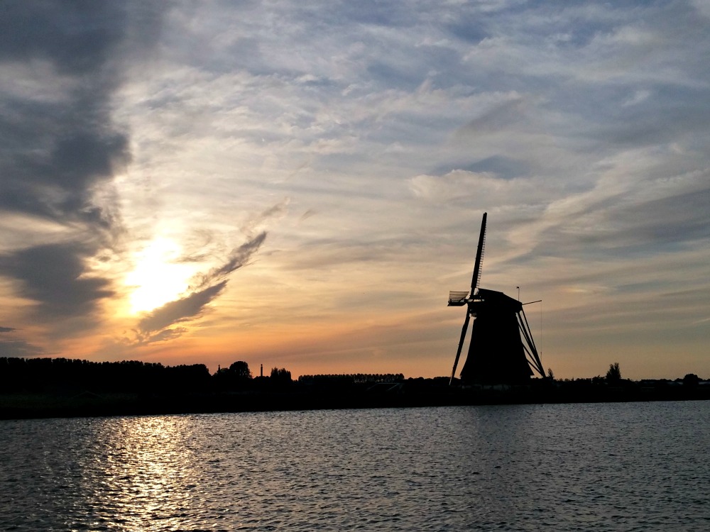 Sunset behind a Dutch windmill