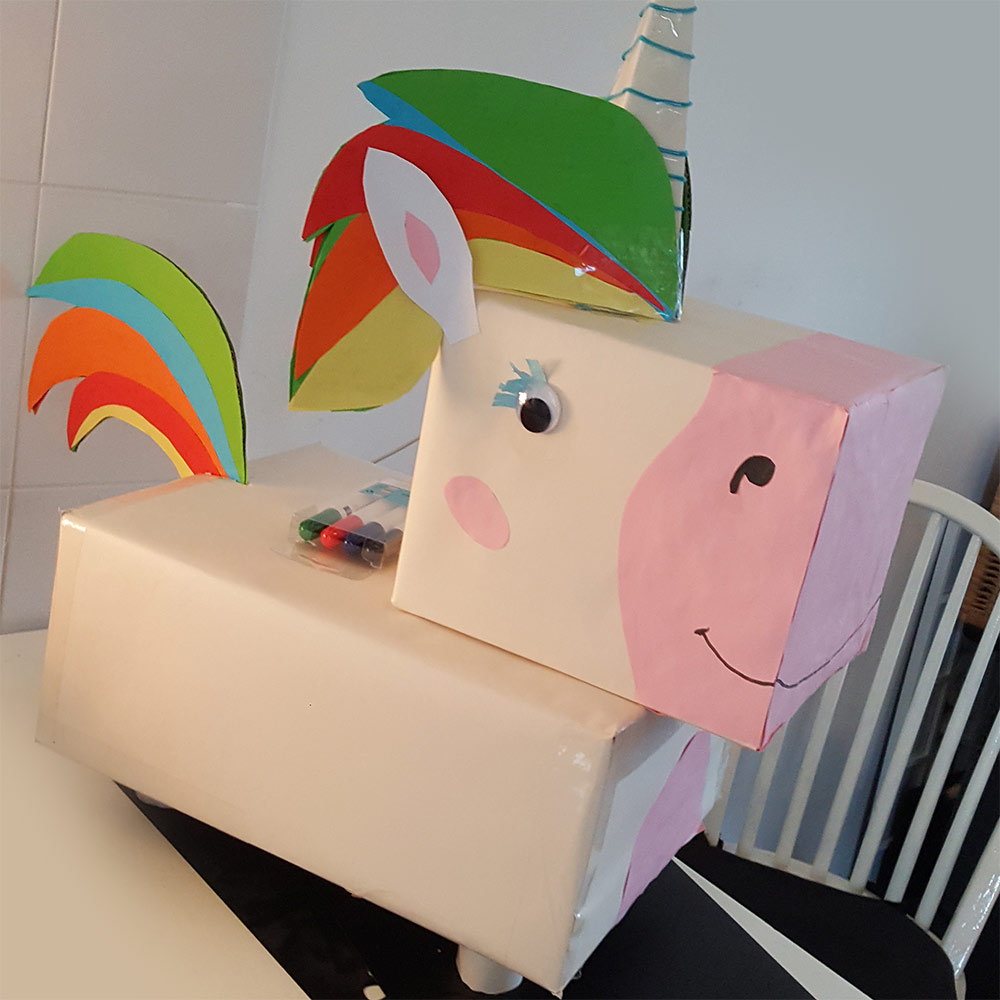 A Sinterklaas Surprise made out of cardboard boxes and paper. The girl loved the unicorn!